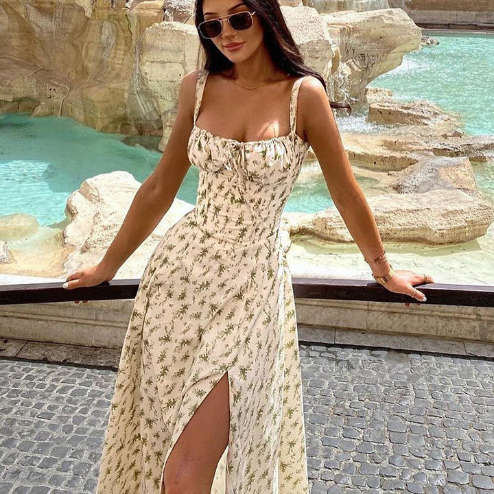 Casual chic floral print sleeveless midi dress for women. Comfortable flowy design with a trendy tie front detail.