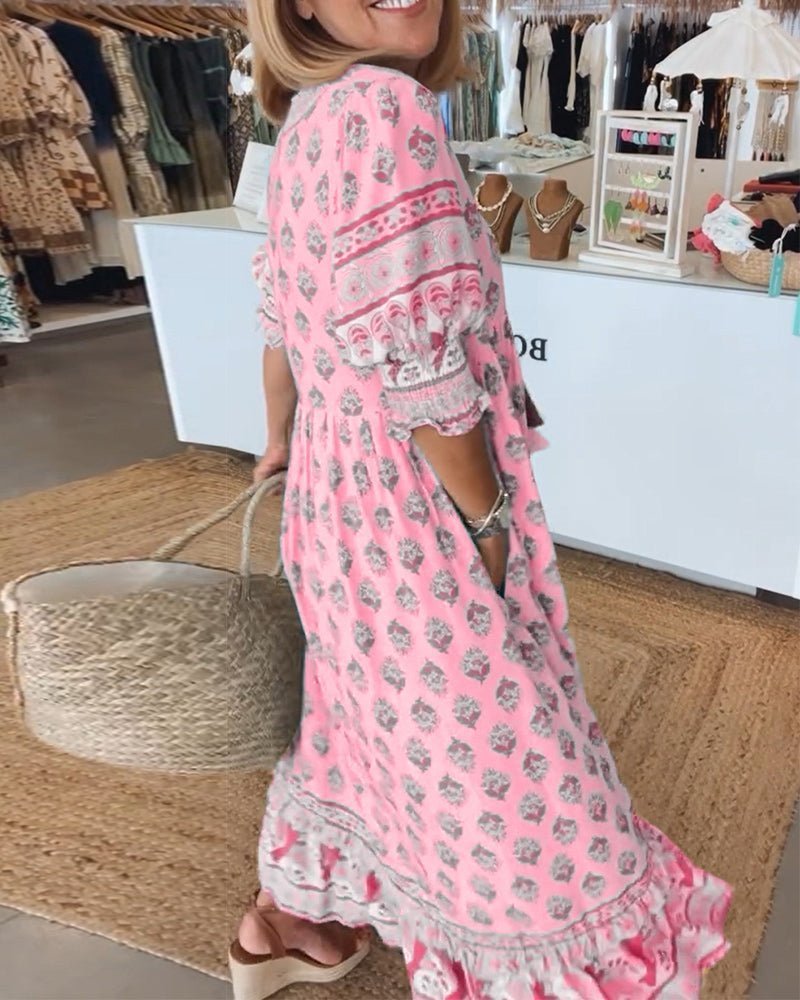 Detailed view of the floral print on a women's V-neck maxi dress, chic & elegant.