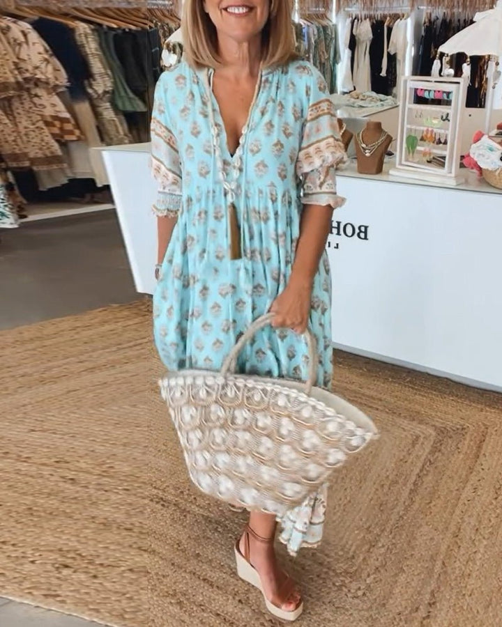 Full-length women's floral V-neck maxi dress, perfect for an elegant and comfortable look.