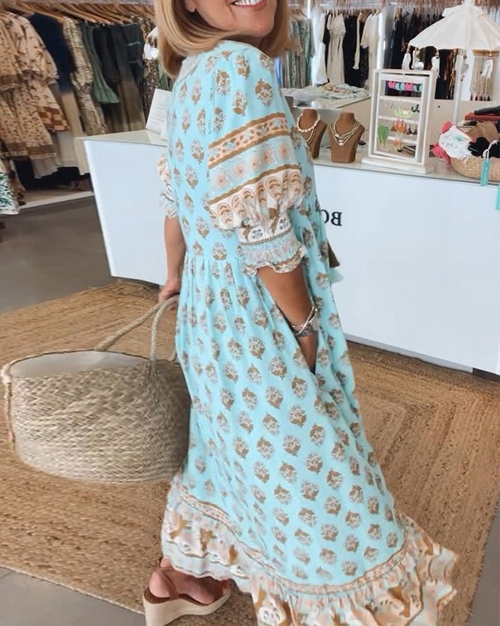Chic floral V-neck maxi dress, ideal for summer parties or casual elegant wear.