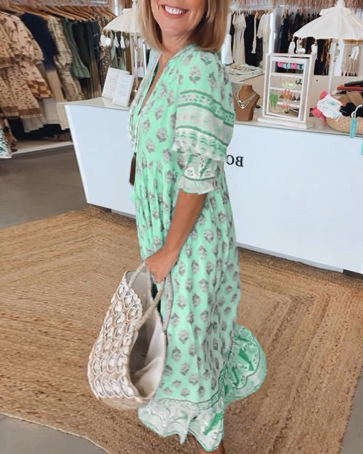 Step out in style with this chic floral V-neck maxi dress, versatile for day or night.
