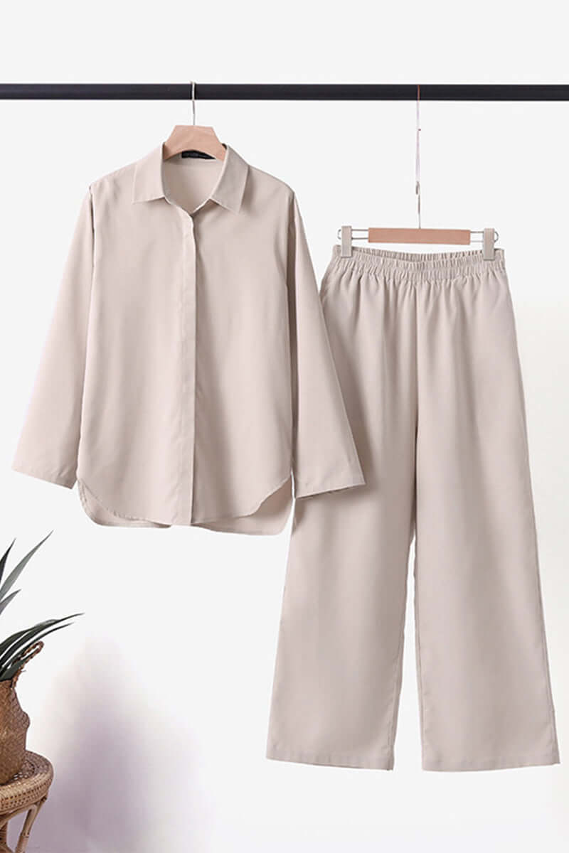 Dark green women's matching set, long sleeve top & pants, with a chic fold-over collar for professional wear.