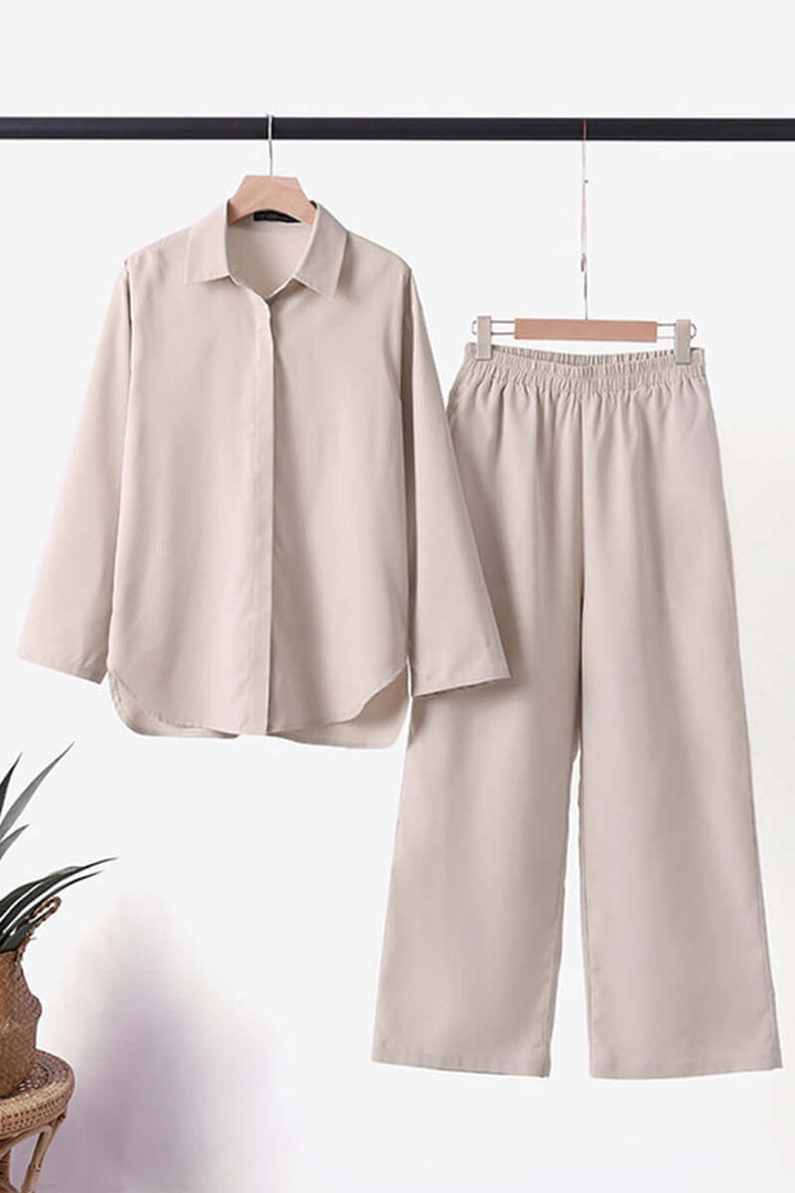 Dark green women's matching set, long sleeve top & pants, with a chic fold-over collar for professional wear.