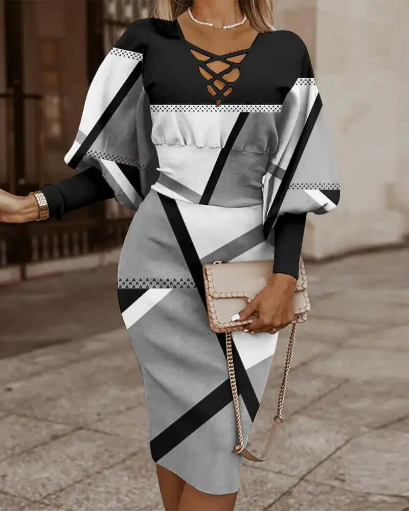 Women's geometric print batwing top with lace-up detail. Part of a stylish two-piece midi skirt set for summer.