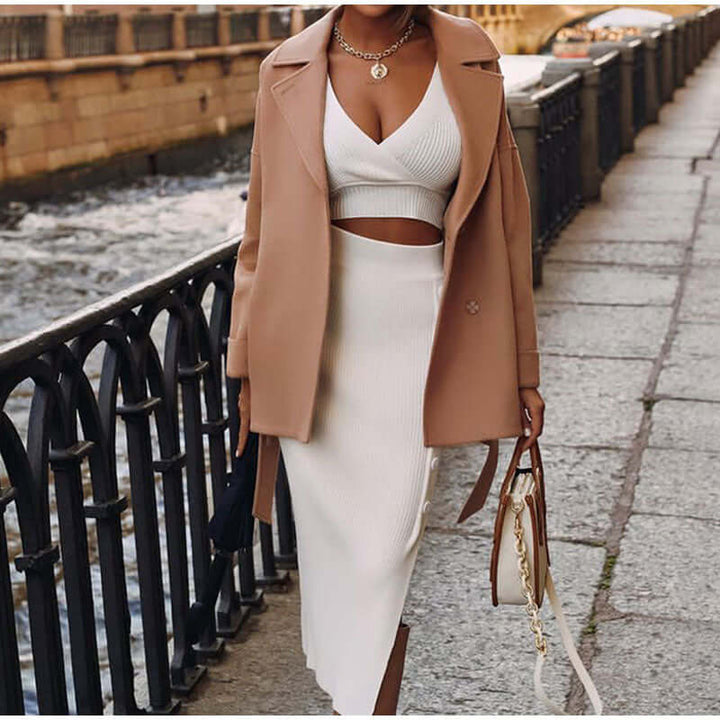 Women's spring/summer knitted set: a versatile V-neck top and midi skirt ensemble for effortless elegance.