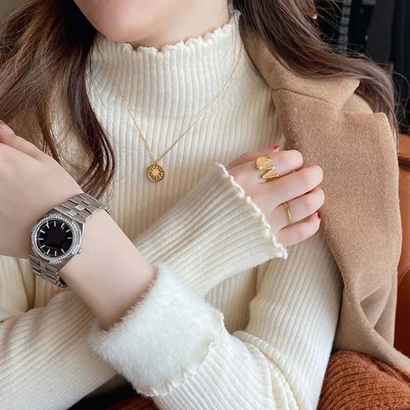 Comfortable women's knit sweater with mock neck and ruffled hem, a chic pullover for autumn & winter fashion.