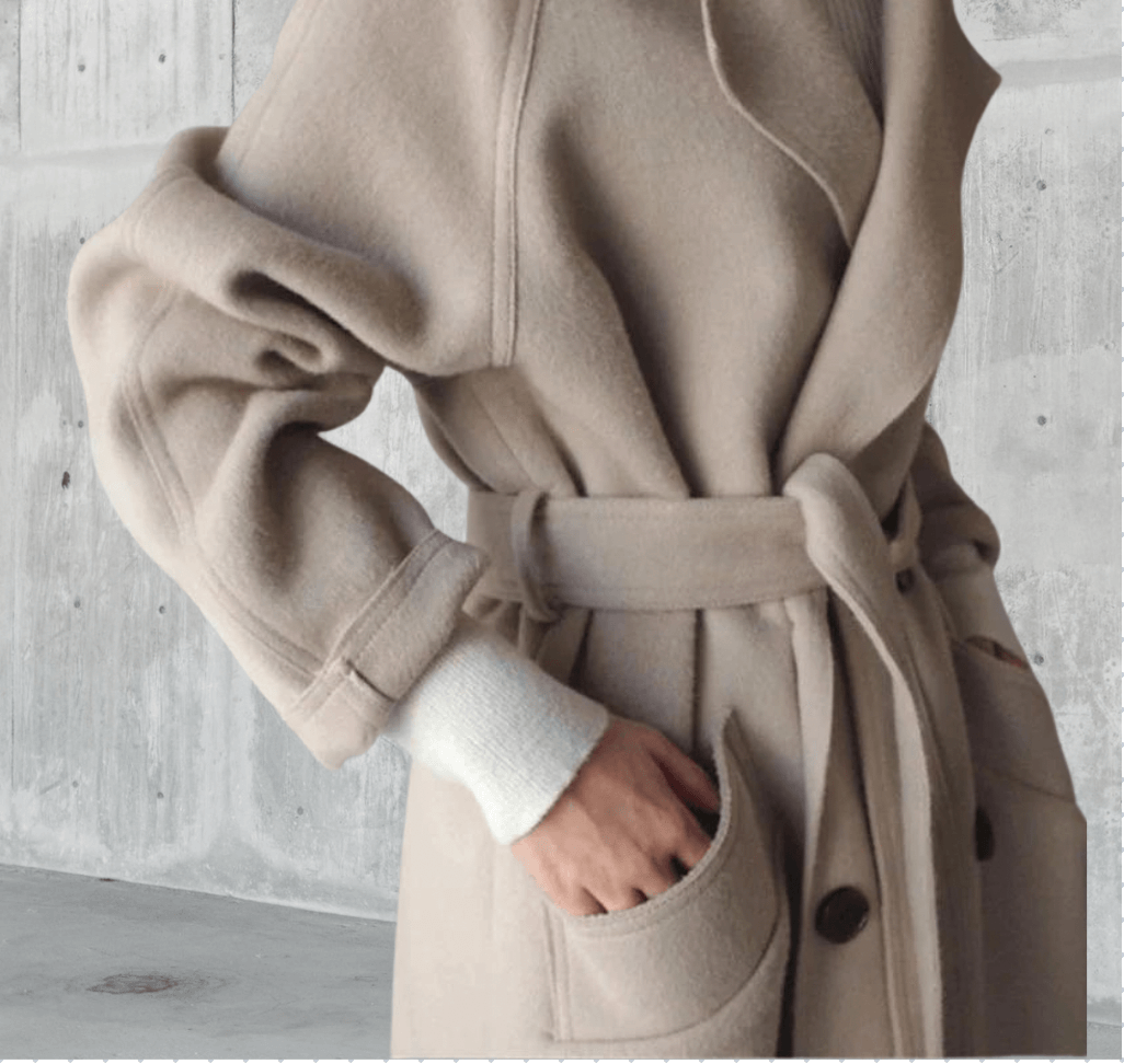 Cozy oversized women's winter coat with a sophisticated belt, great for chilly days and style.
