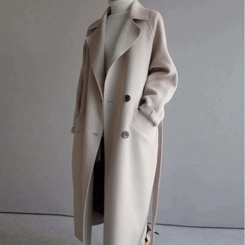 Fashionable women's long oversized coat, featuring a chic belt, perfect winter outerwear jacket.