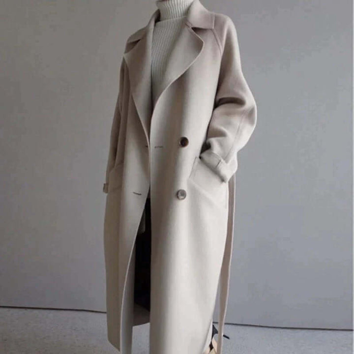 Fashionable women's long oversized coat, featuring a chic belt, perfect winter outerwear jacket.