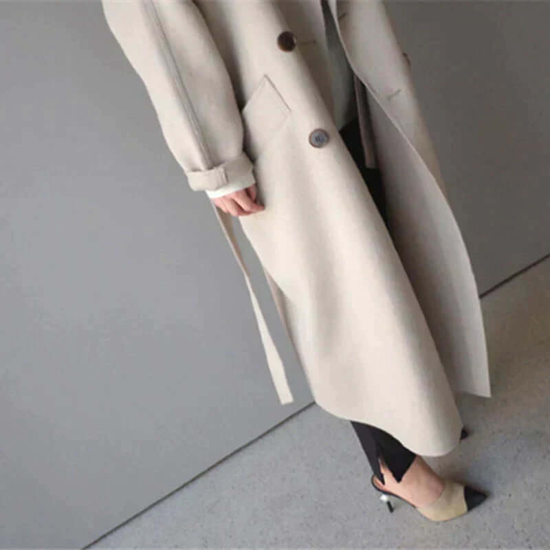 Ladies' chic belted oversized winter coat, a stylish and warm long jacket for ultimate comfort.