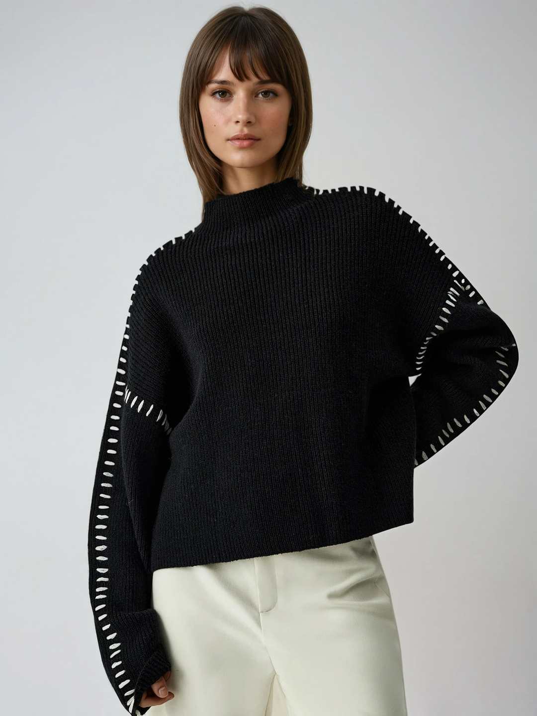 Women's chic oversized black mock neck sweater, relaxed fit, perfect for fall and winter style.