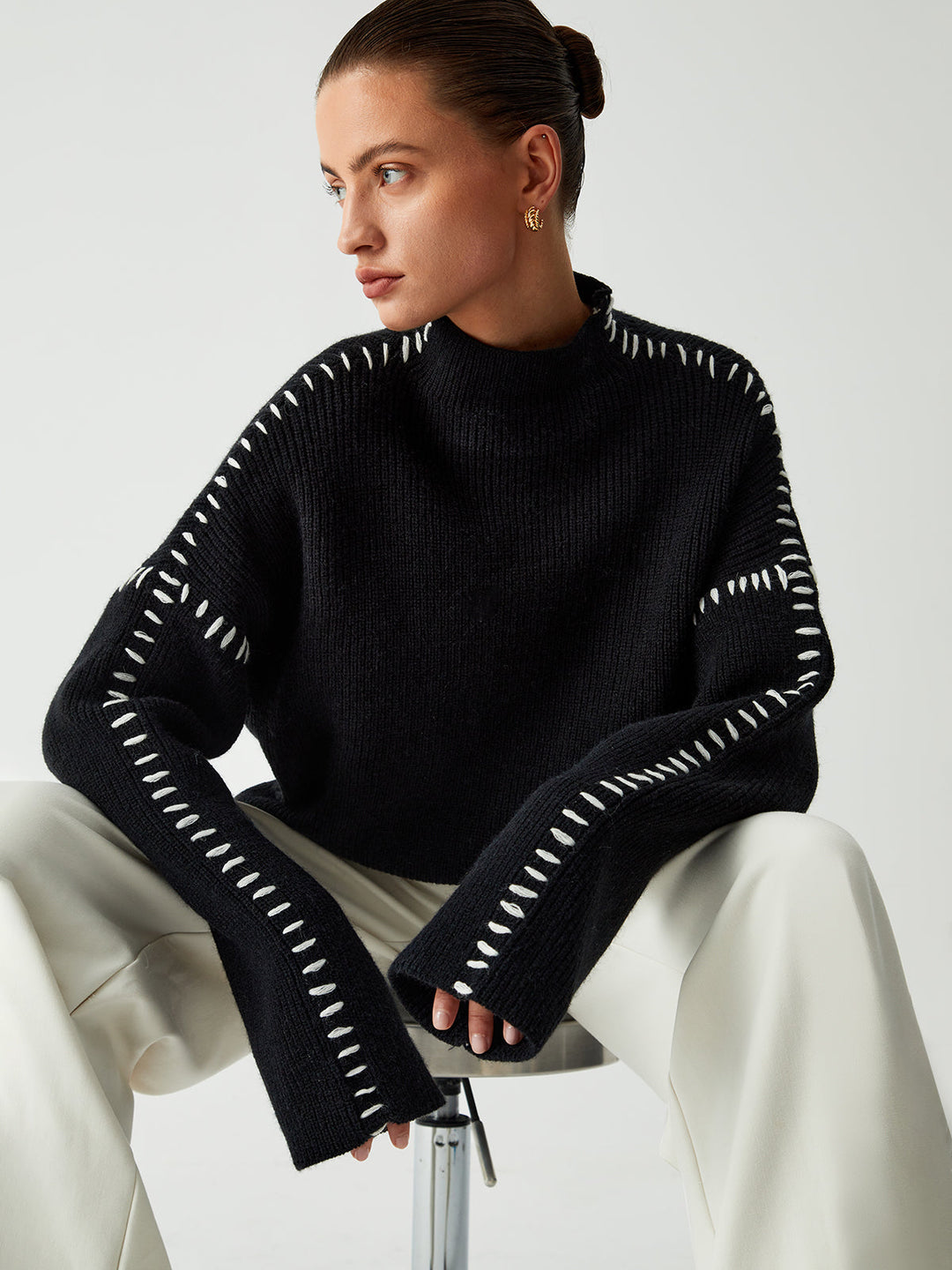 Versatile women's black oversized mock neck sweater. Great for casual fashion, comfortable everyday wear.