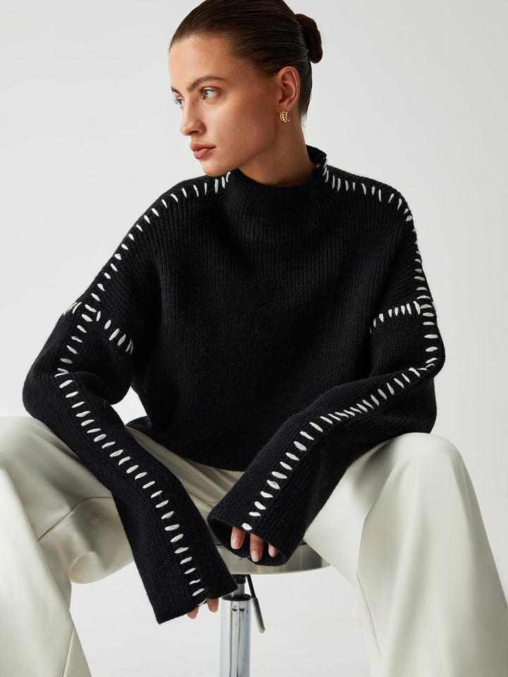Versatile women's black oversized mock neck sweater. Great for casual fashion, comfortable everyday wear.