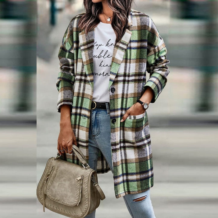 Fashionable women's plaid jacket featuring long sleeves and a button front. Perfect for casual fall and winter style.