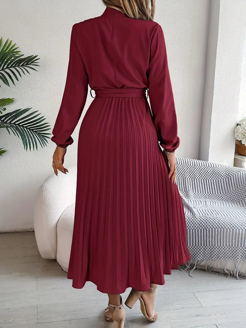 Women's formal pleated midi dress, elegant with belt, long sleeves & high neck. Ideal special occasion dress.