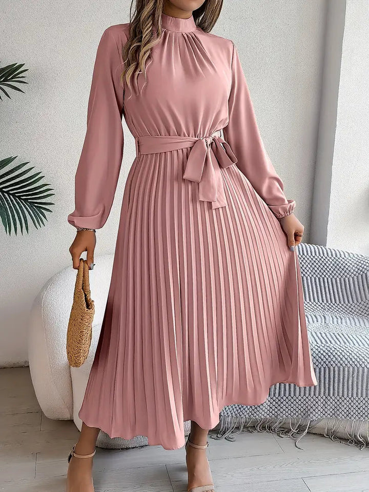 Chic women's high neck midi dress, pleated design & belt. Elegant party dress, ideal for wedding guests.
