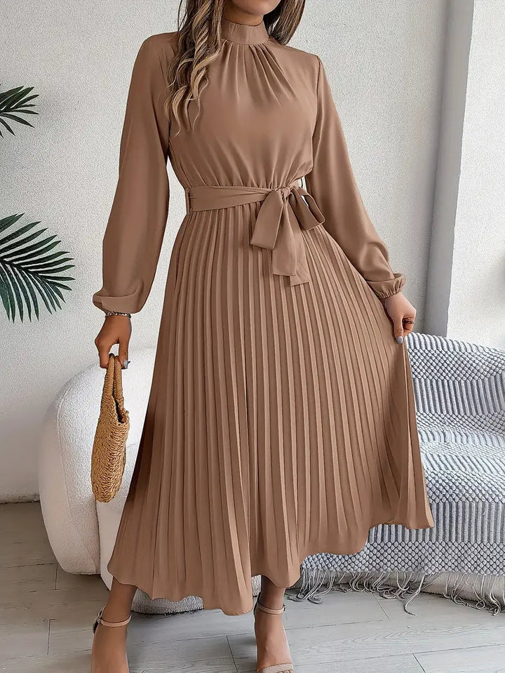 Elegant long sleeve midi dress, women's formal pleated design with belt & high neck. Perfect wedding guest.