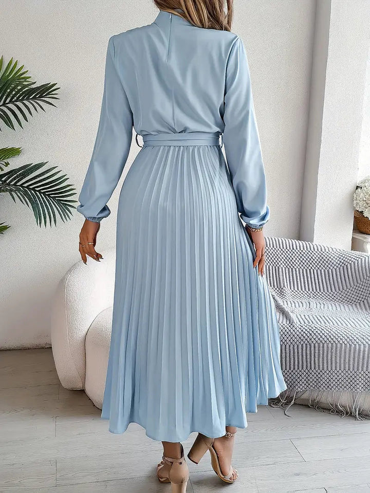 Sophisticated women's pleated midi dress with a belt. Chic long sleeve, high neck for formal events.