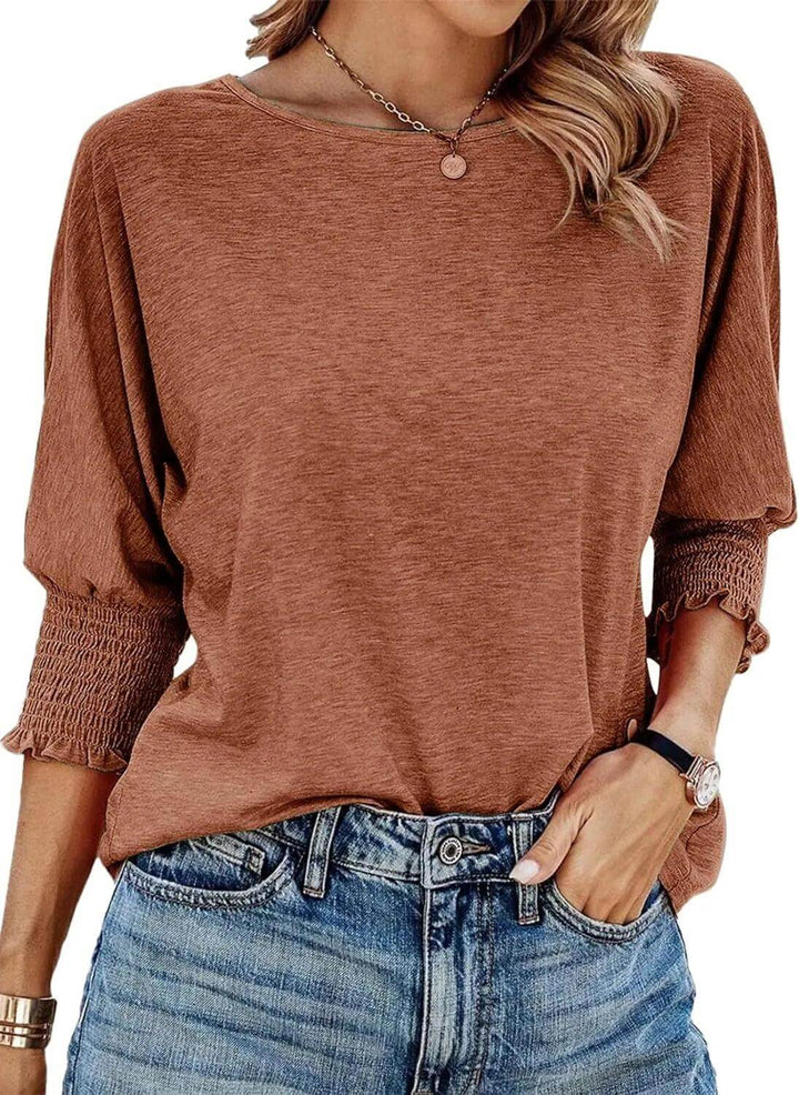Fashionable women's long sleeve ribbed knit top. Comfortable, versatile, perfect for everyday style.