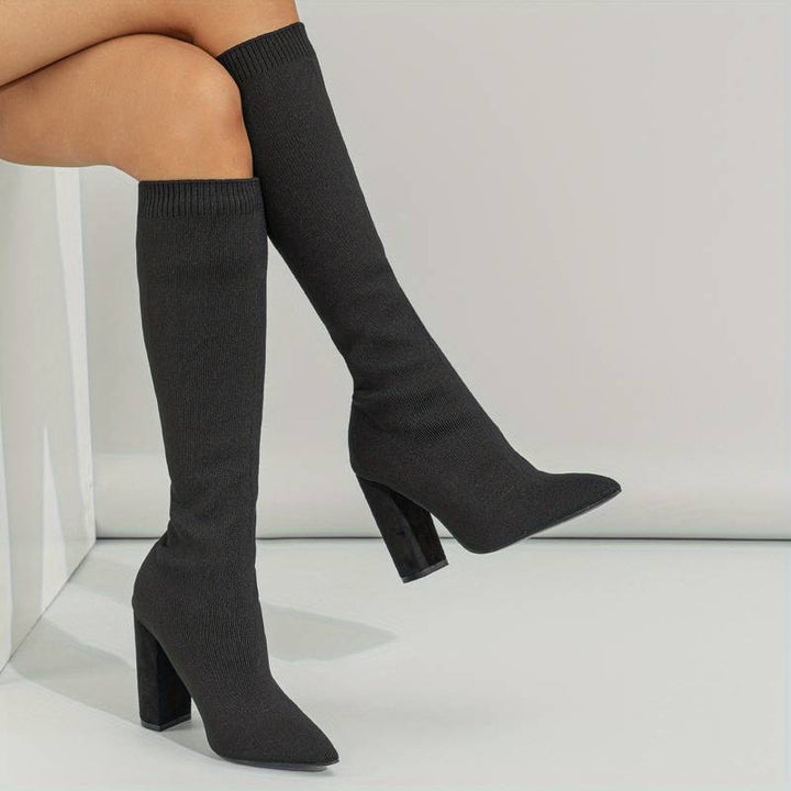 Elegant women's ribbed knit sock boots, featuring a sleek pointed toe and comfortable block heel for everyday wear.