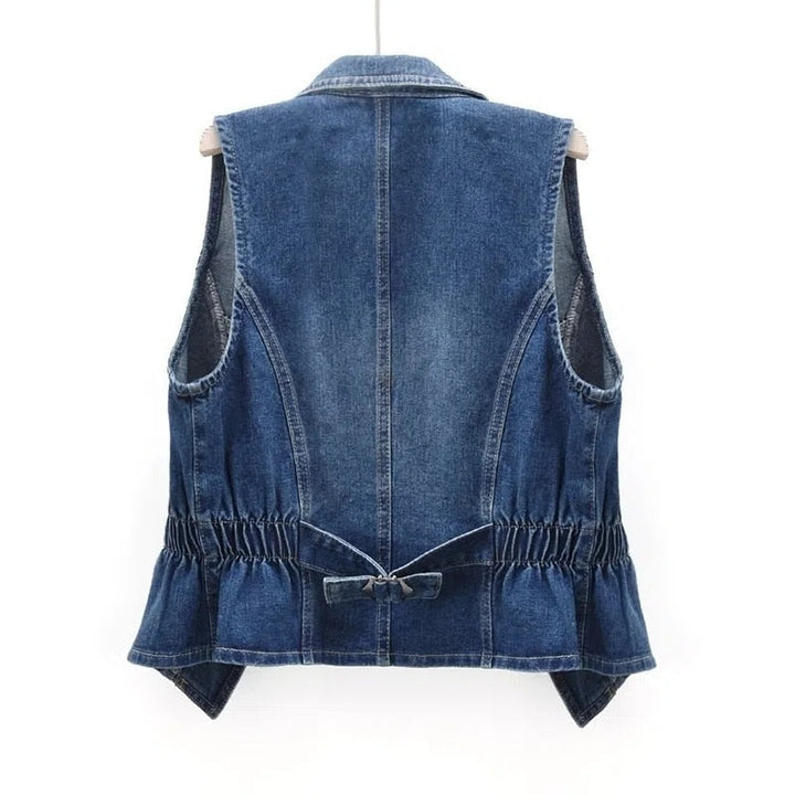 Stylish women's blue denim sleeveless vest. Casual layering piece, perfect for streetwear fashion & everyday style.