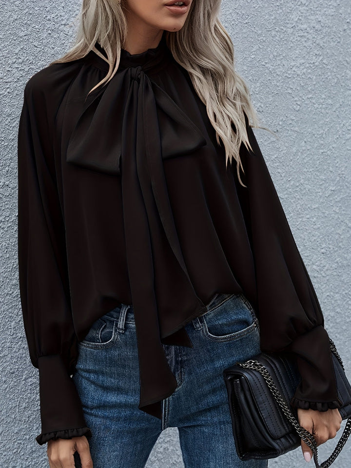 Effortless chic women's long sleeve blouse with a fashionable tie neck, ideal for any occasion.
