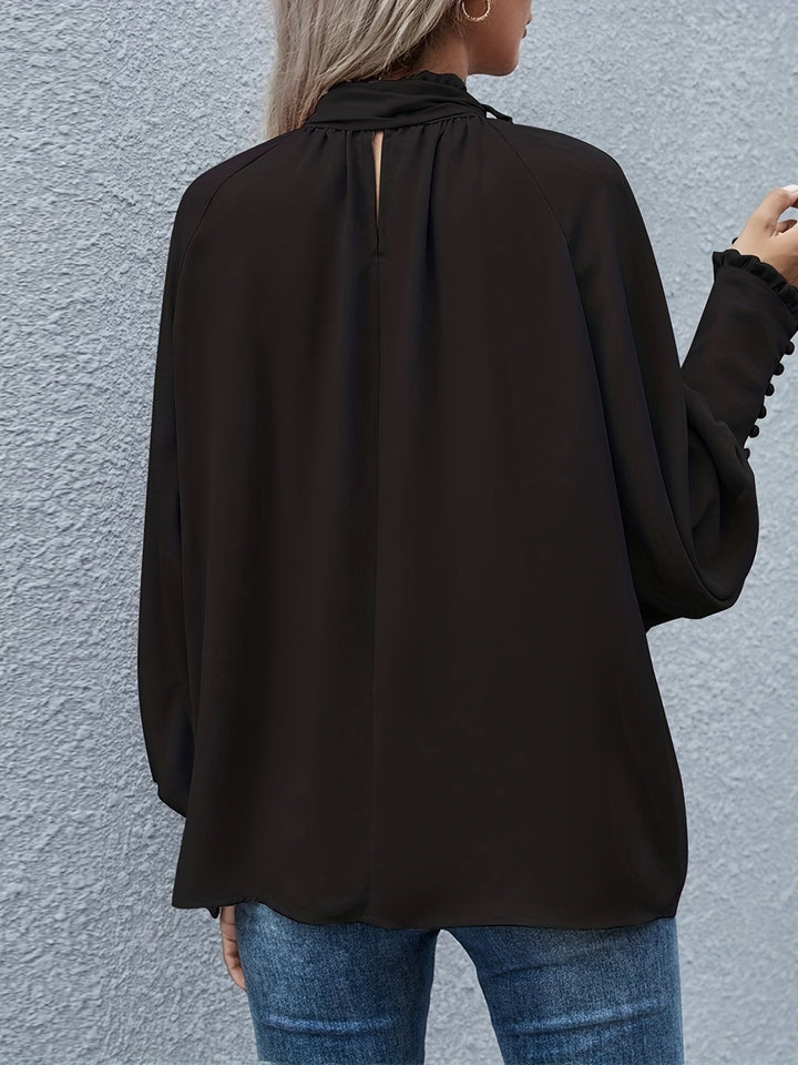 Modern elegant women's long sleeve blouse with a stylish tie neck. Perfect for office or casual wear.
