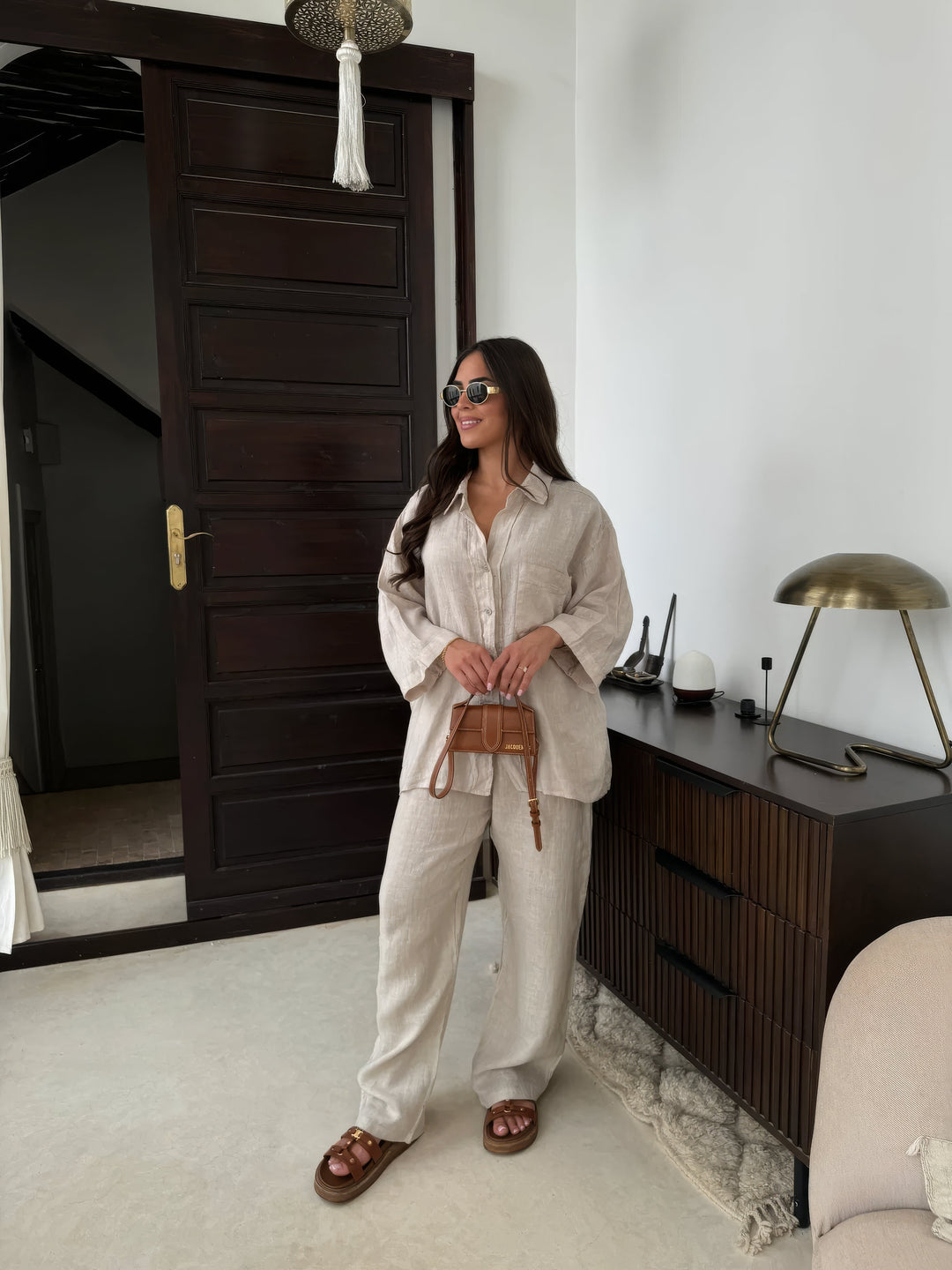 Women's chic two-piece wide-leg pant set with long sleeve top for effortless summer style.