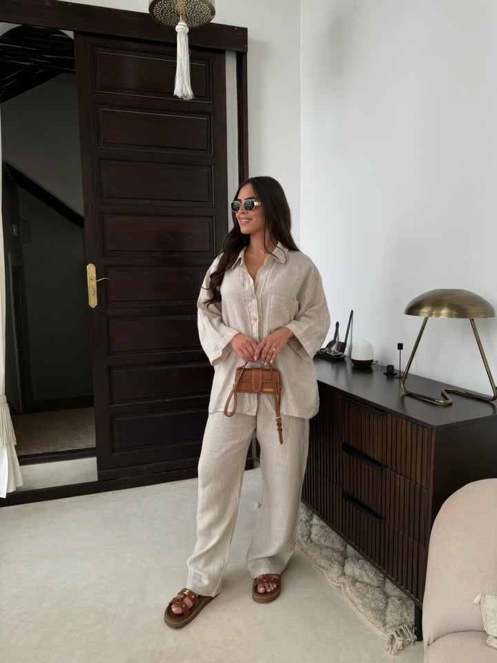 Women's chic two-piece wide-leg pant set with long sleeve top for effortless summer style.
