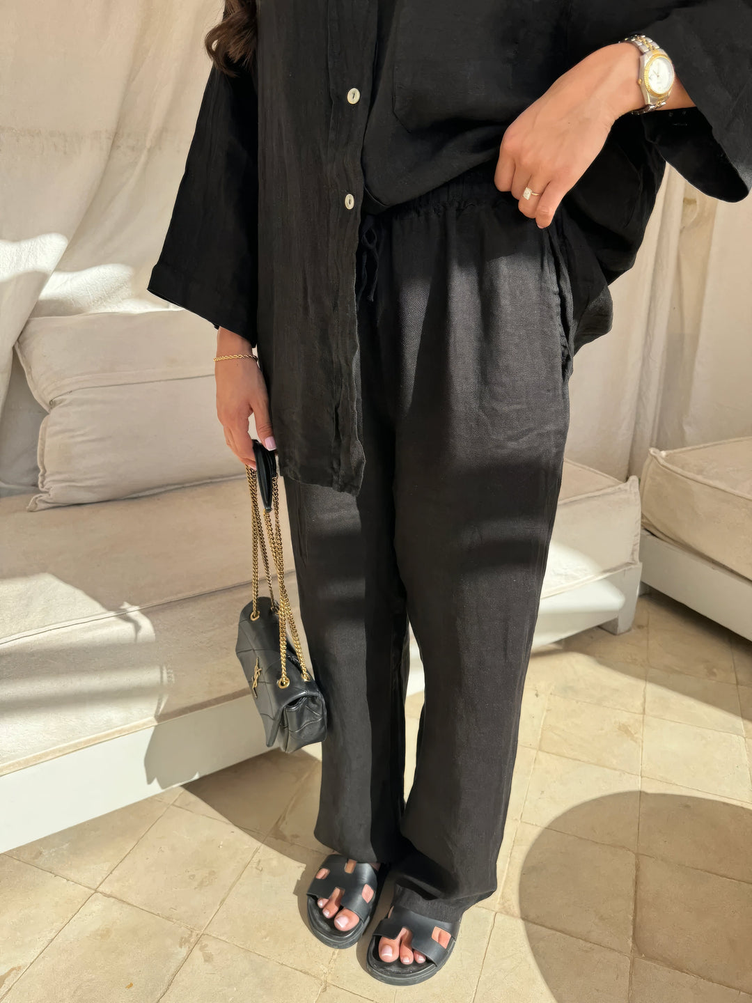 Stylish women's summer two-piece long-sleeve top and wide-leg pant set for casual or elegant outfits.