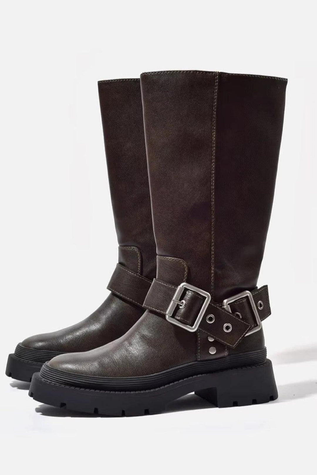 Women's chunky knee-high flat boots in brown, perfect for modern everyday style and winter fashion.