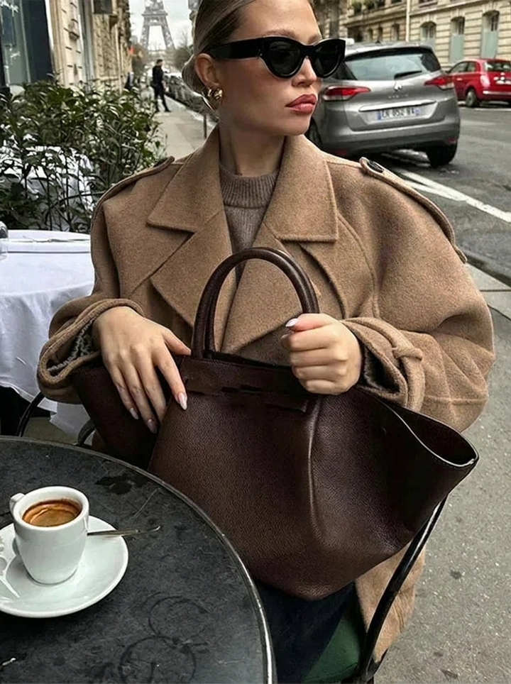 Brown double-breasted cropped trench coat for women. Classic style, great fall fashion statement & versatile layering.
