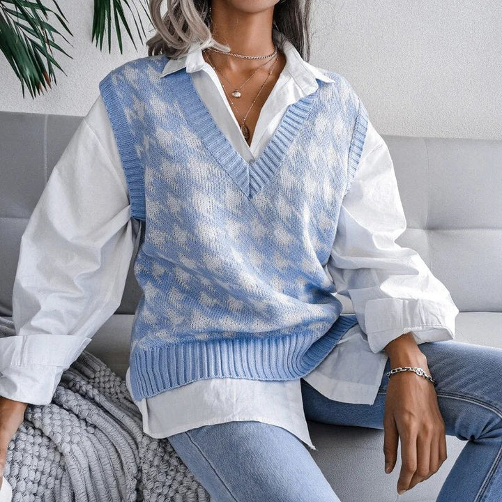 Chic women's houndstooth knitted vest with V-neck. An elegant layering piece for transitional and fall fashion.