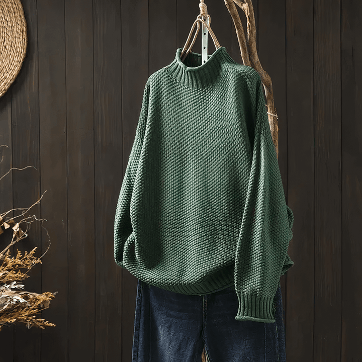 Women's classic knit turtleneck sweater in a relaxed fit, perfect for cozy winter warmth and timeless style.