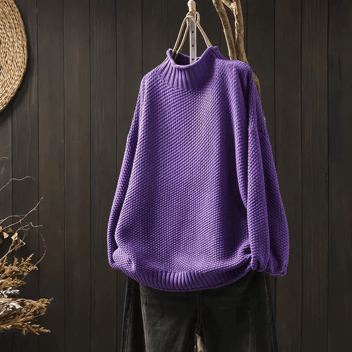 Stylish women's turtleneck sweater with long sleeves, a versatile and cozy classic for any winter or fall outfit.