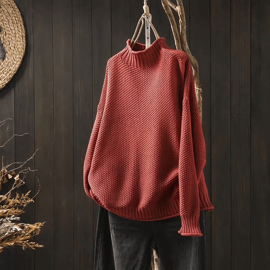 Close-up of a women's soft knit turtleneck sweater, showcasing the classic design and comfortable, warm fabric.