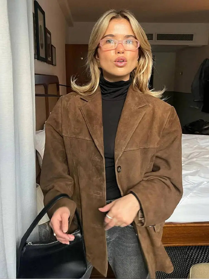 Women's classic outerwear jacket on a model, demonstrating its elegant fit and versatile style for casual or chic looks.