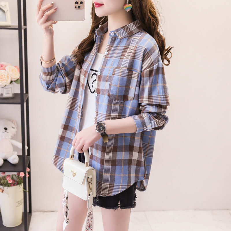 Women's button-down long sleeve shirt featuring a vibrant classic plaid pattern. Ideal casual top for autumn style.