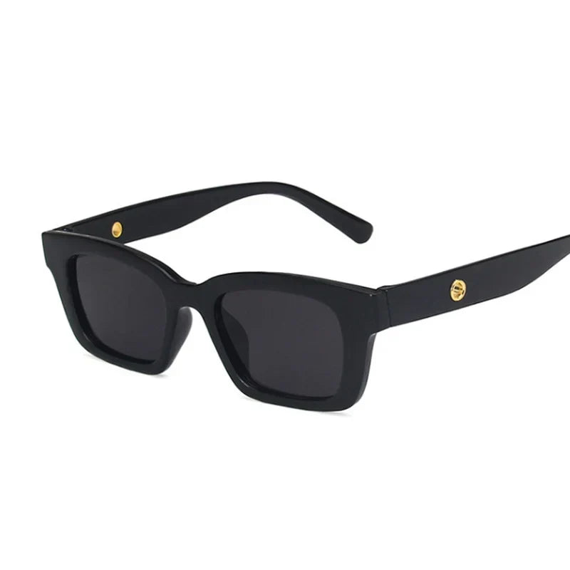 Black women's rectangular wayfarer sunglasses with dark lenses, offering chic fashion eyewear & UV protection.