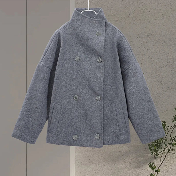 Women's chic pea coat, features a stylish stand collar for sophisticated winter fashion.
