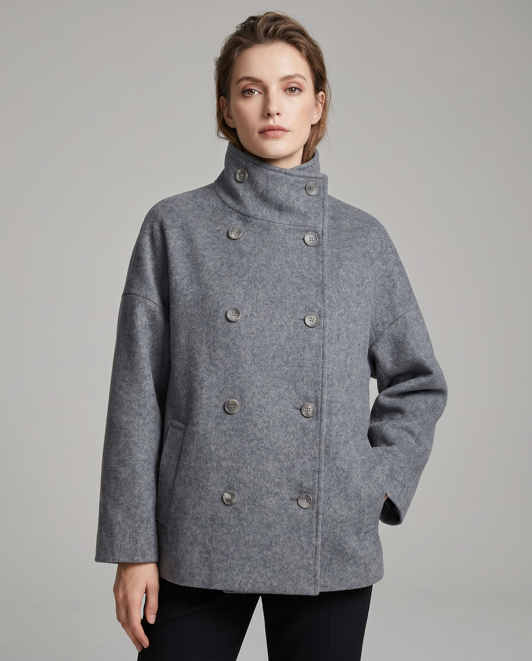 Chic women's pea coat with a stylish stand collar, perfect timeless layering piece.