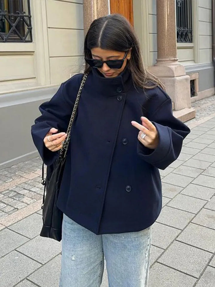 Women's elegant stand collar pea coat, a classic layering piece for refined fashion.