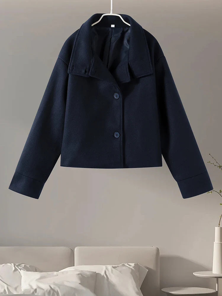 Sophisticated women's pea coat with a stand collar, perfect for a chic winter look.
