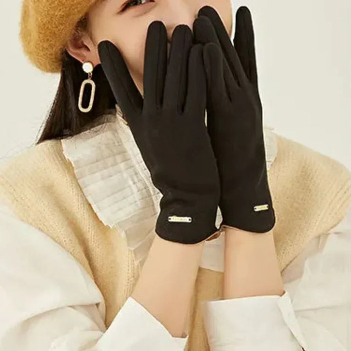 Chic women's suede winter gloves, combining warmth with touchscreen accuracy.