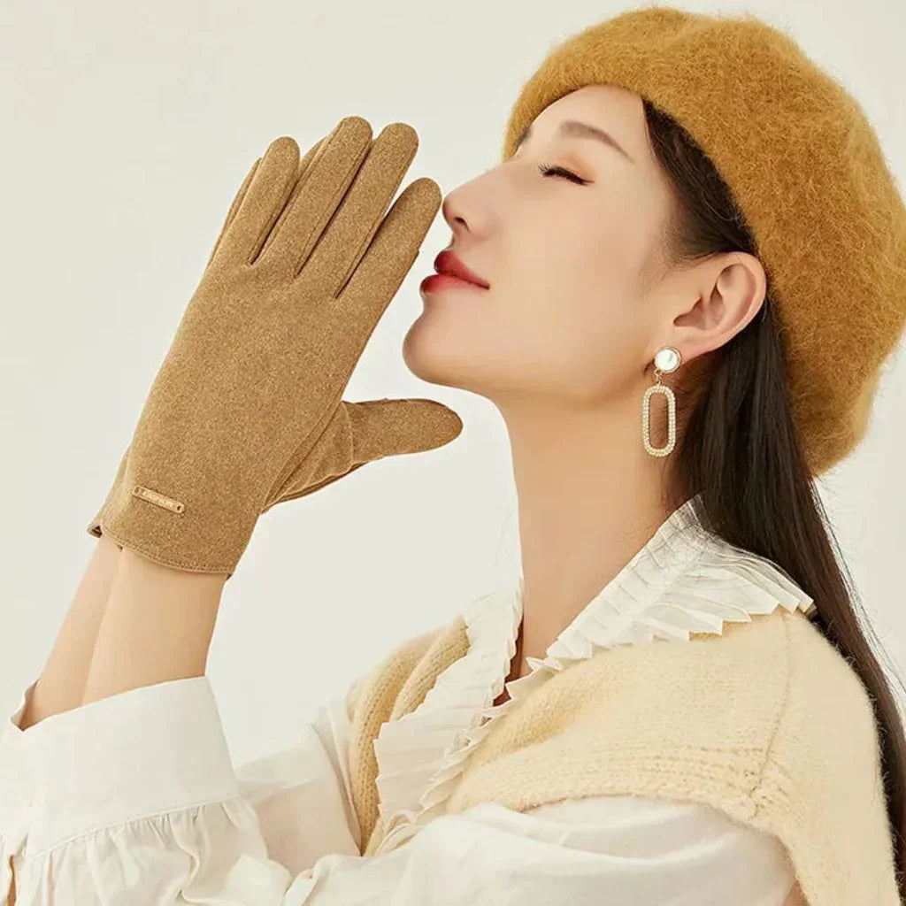 Soft women's suede gloves for winter, designed with full touchscreen functionality.