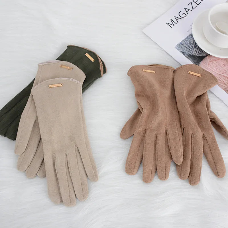 Women's elegant suede winter gloves, offering warmth and smartphone compatibility.