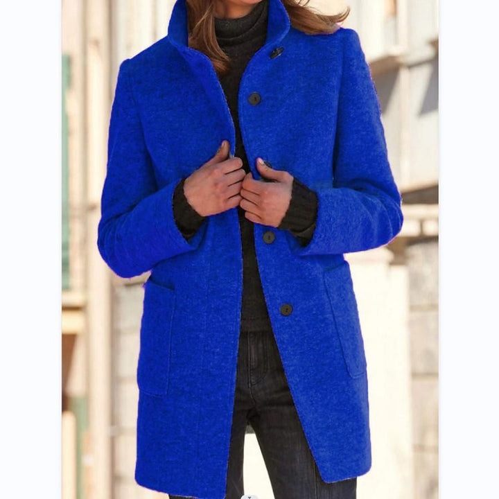 Stylish women's classic wool coat with prominent retro button closure. Elegant long trench for fashion.