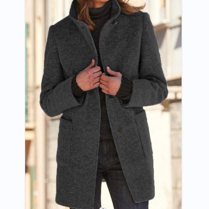 Ladies' classic wool trench coat with retro button detail. Elegant long outerwear, essential for fall fashion.