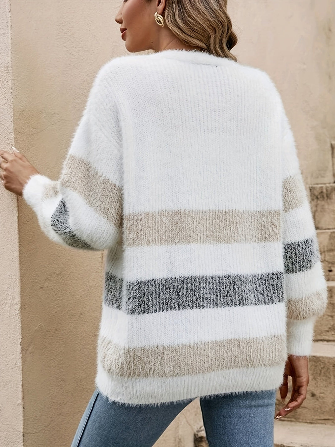 Cozy women's color block button-up cardigan. Long-sleeve layering piece for fall and winter casual wear.