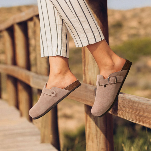 Cozy women's home slippers featuring ergonomic design, cushioned footbed & non-slip sole for indoor use.